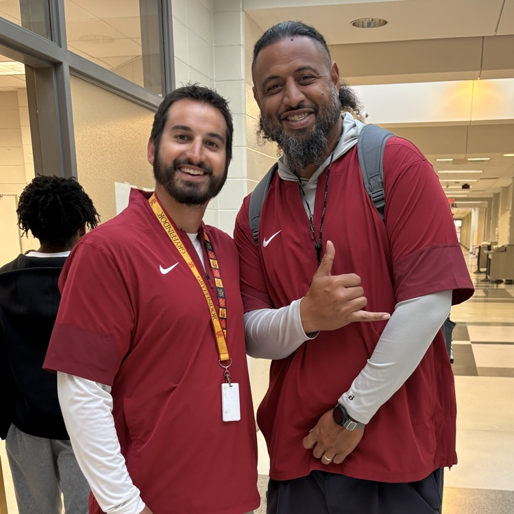 two coaches posing