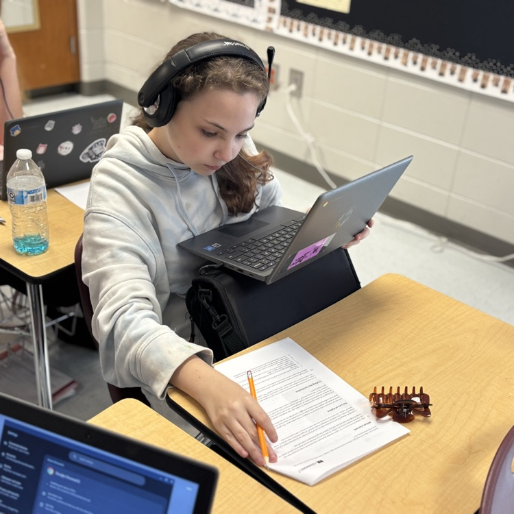 students reading and analyzing an article 
