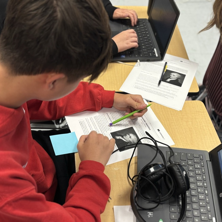 students reading and analyzing an article 