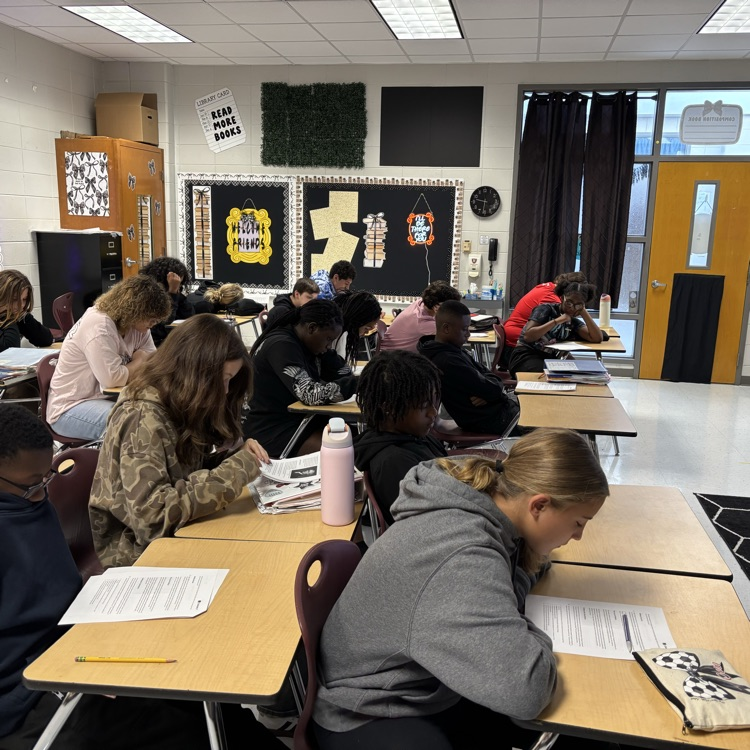 students reading and analyzing an article 