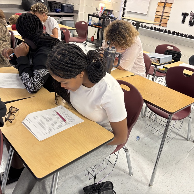 students reading and analyzing an article 