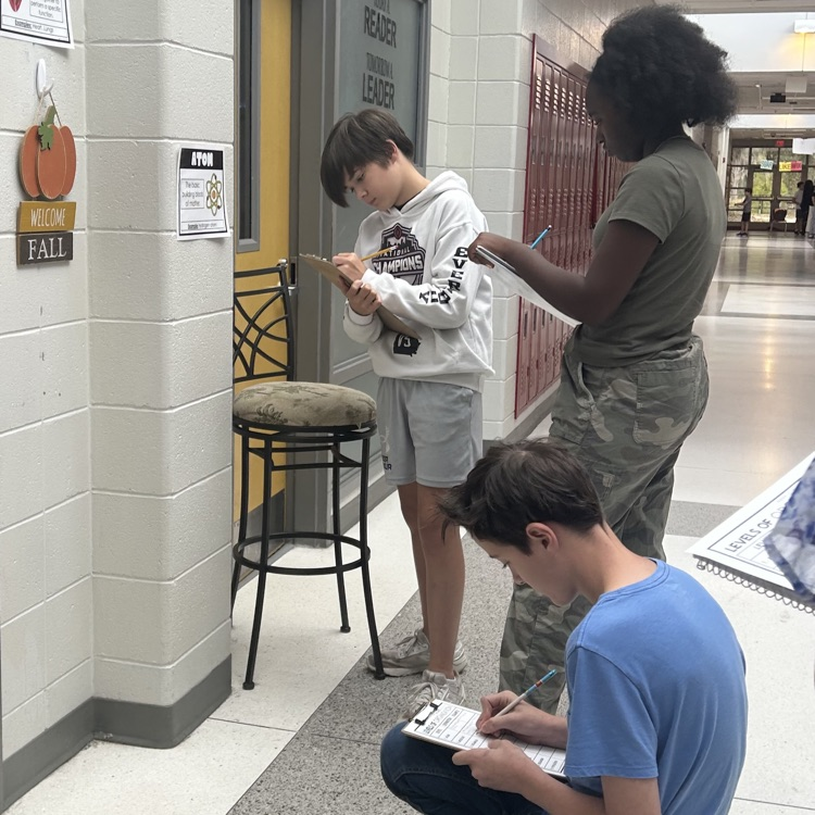 students completing science activity 