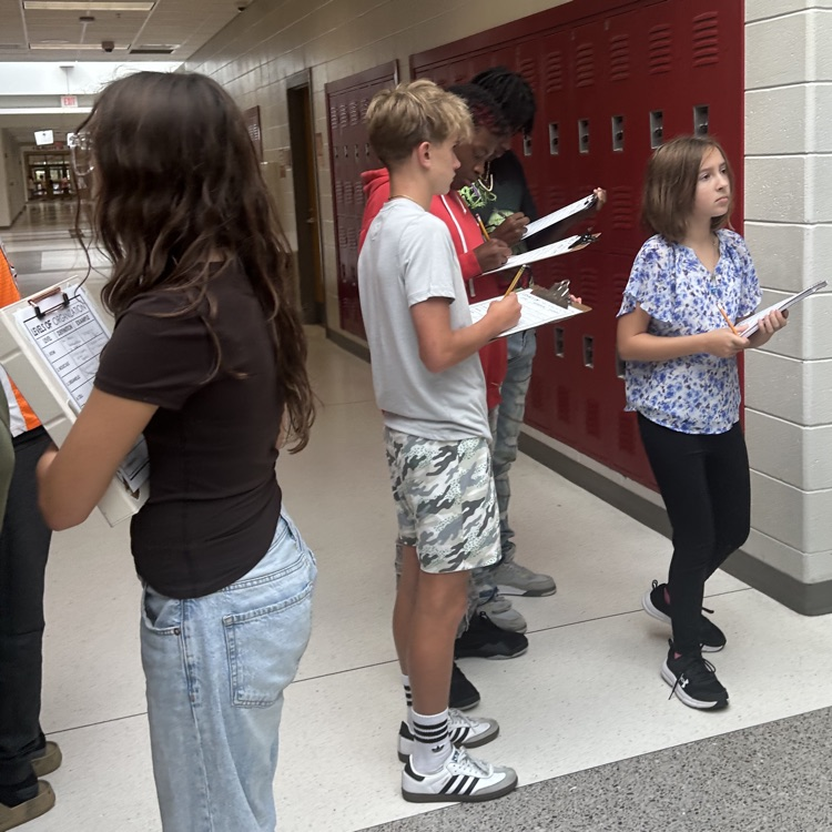 students completing science activity 
