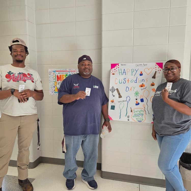 custodians posing with cards 