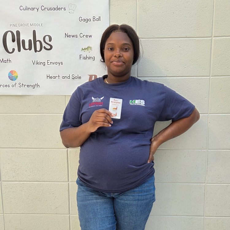 custodian posing with card 