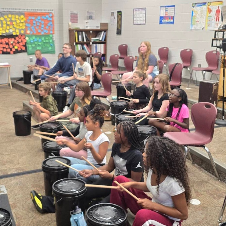 students drumming