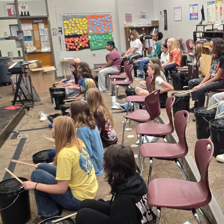 students drumming