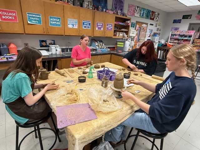 LHS students working on monster sculptures