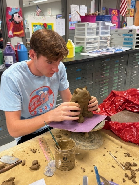 LHS students working on monster sculptures