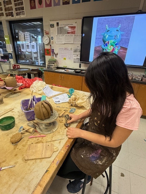 LHS students working on monster sculptures