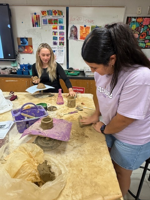 LHS students working on monster sculptures