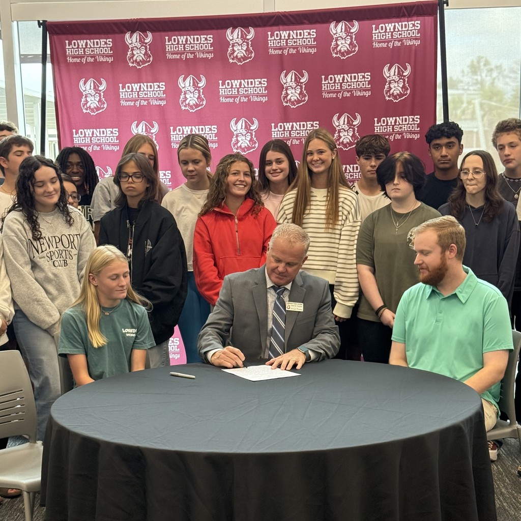 Mr. Dickey signing a proposed bill.