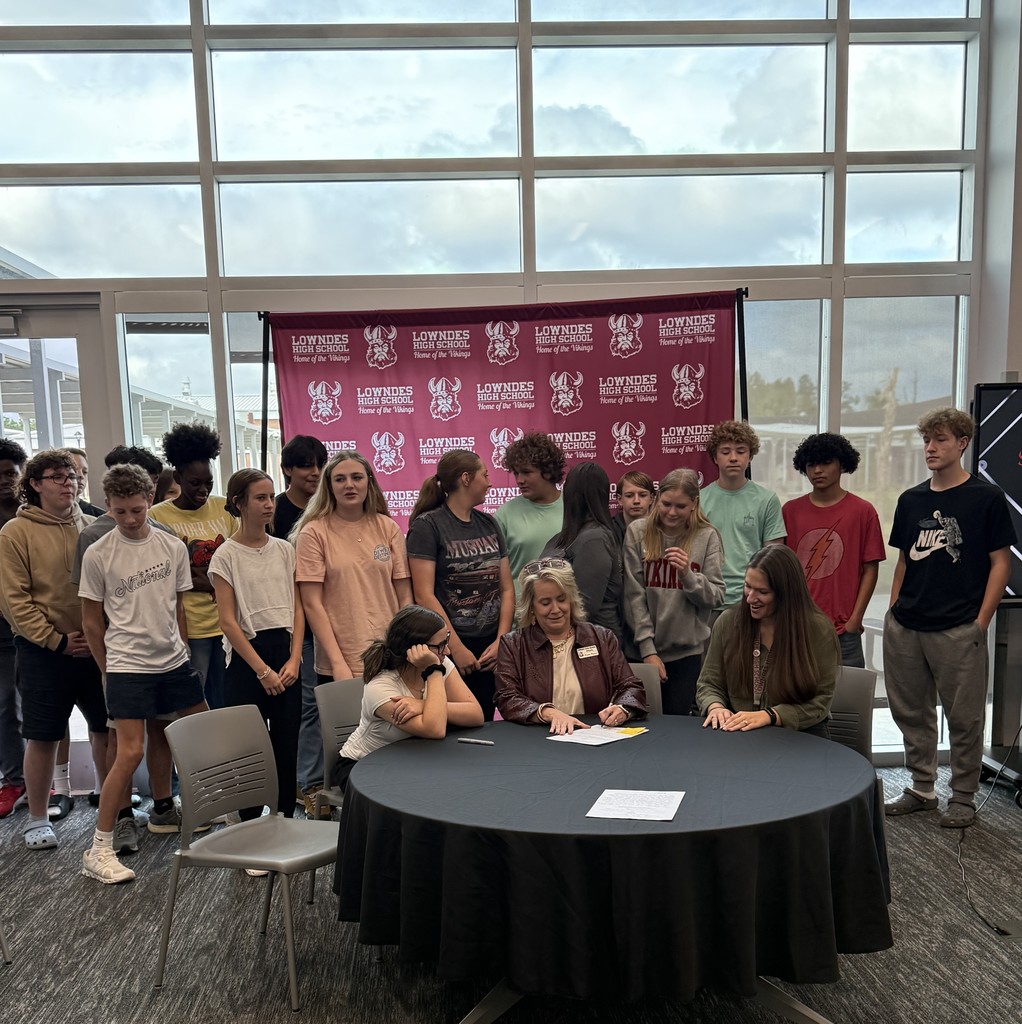 Mrs. Pearson signing a proposed bill for Mrs. McDonald's class