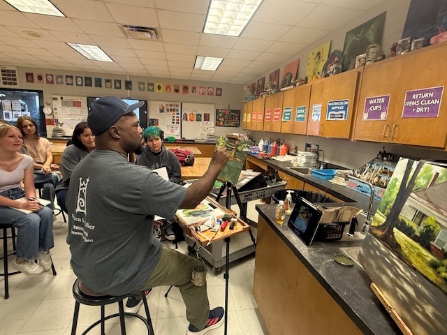 Local artist demonstrating for art students