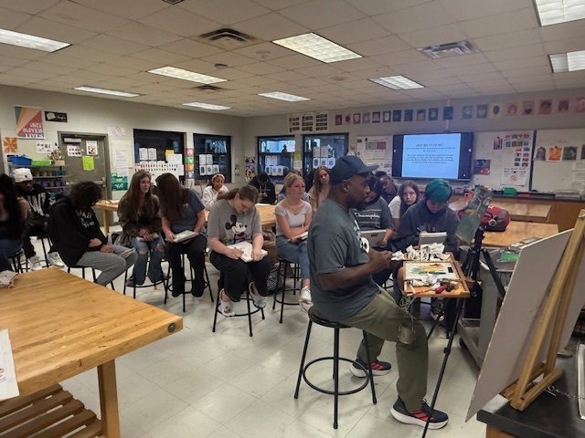 Local artist demonstrating for art students