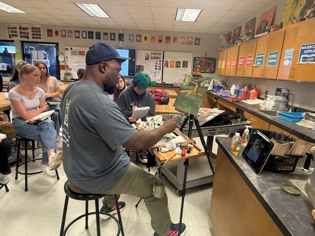 Local artist demonstrating for art students