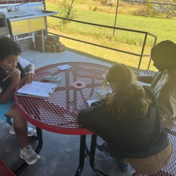students working on math outside