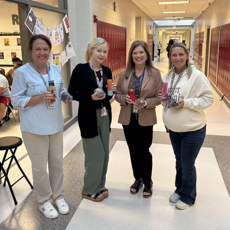 teachers posing with snacks