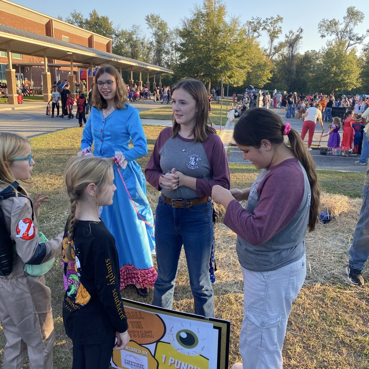 students helping at fall festival 