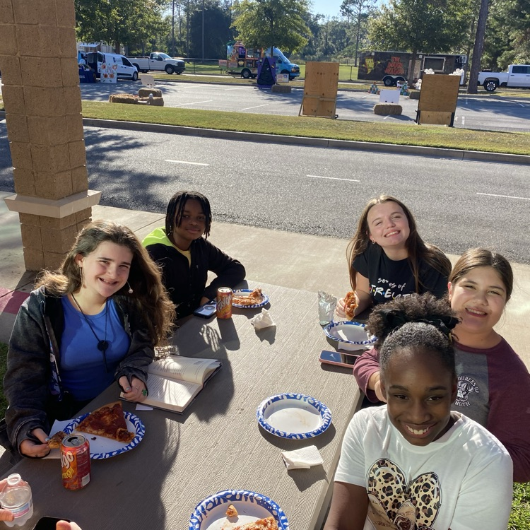 students helping at fall festival 