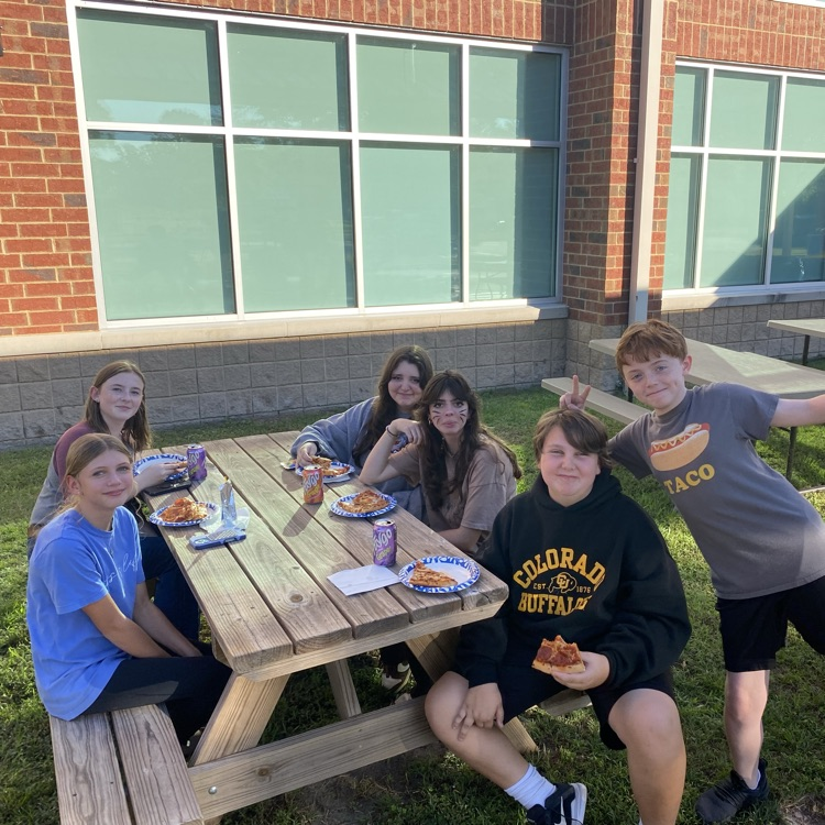 students helping at fall festival 