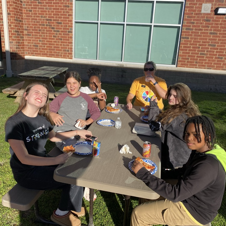 students helping at fall festival 