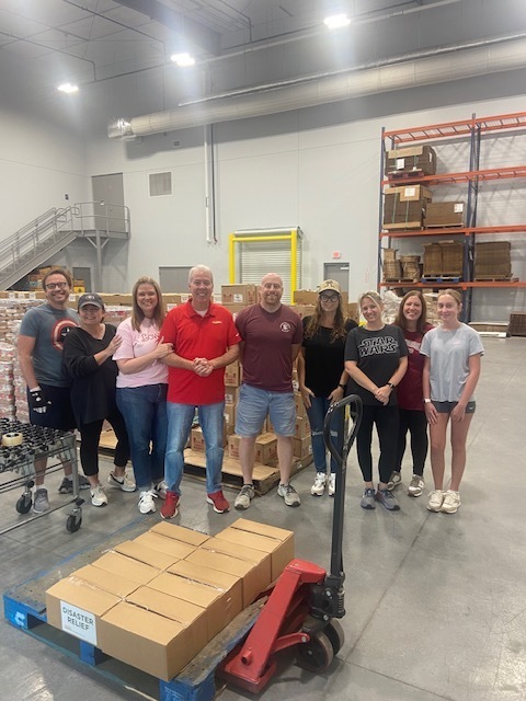 ELA family packing boxes at Second Harvest