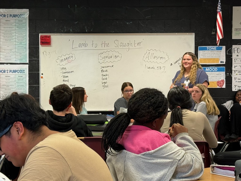 Ansley guiding a middle school class through an activity