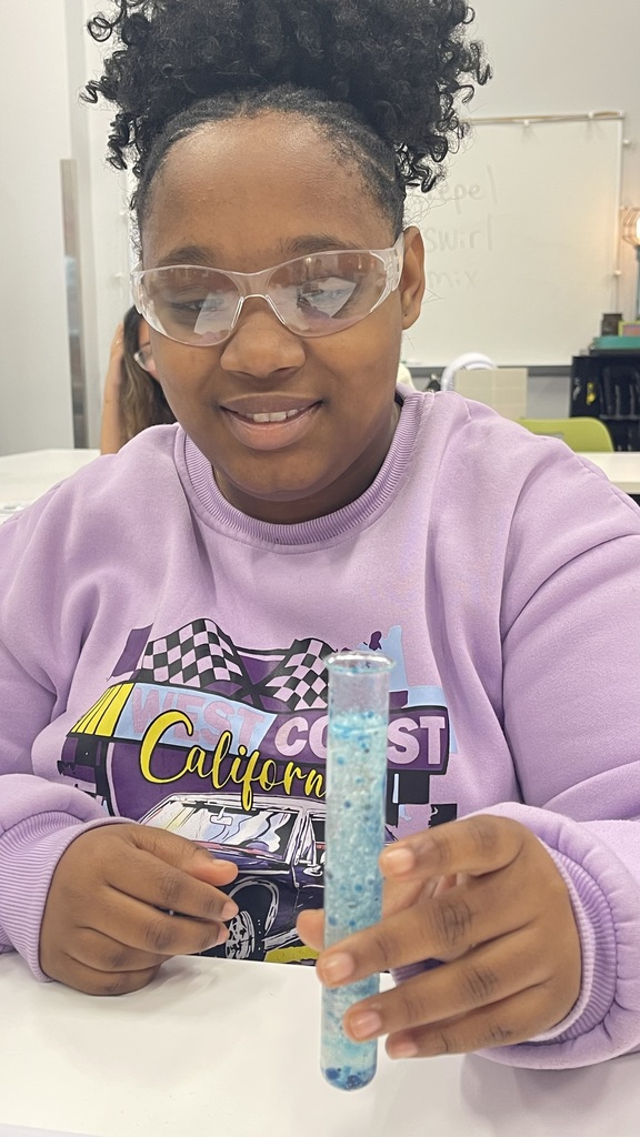 Student holding test tube