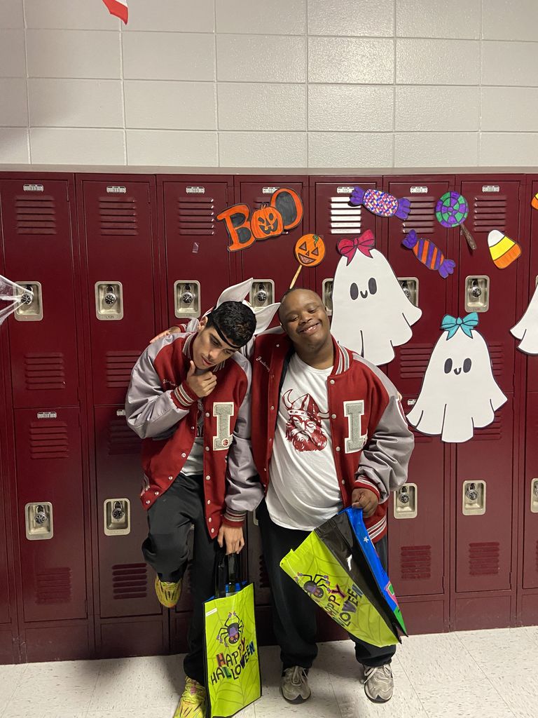 Students stopping to pose while trick or treating
