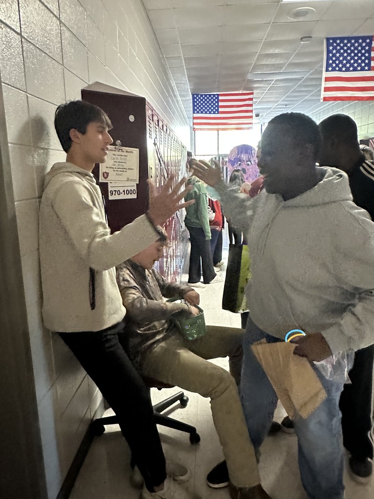 Students high-fiving