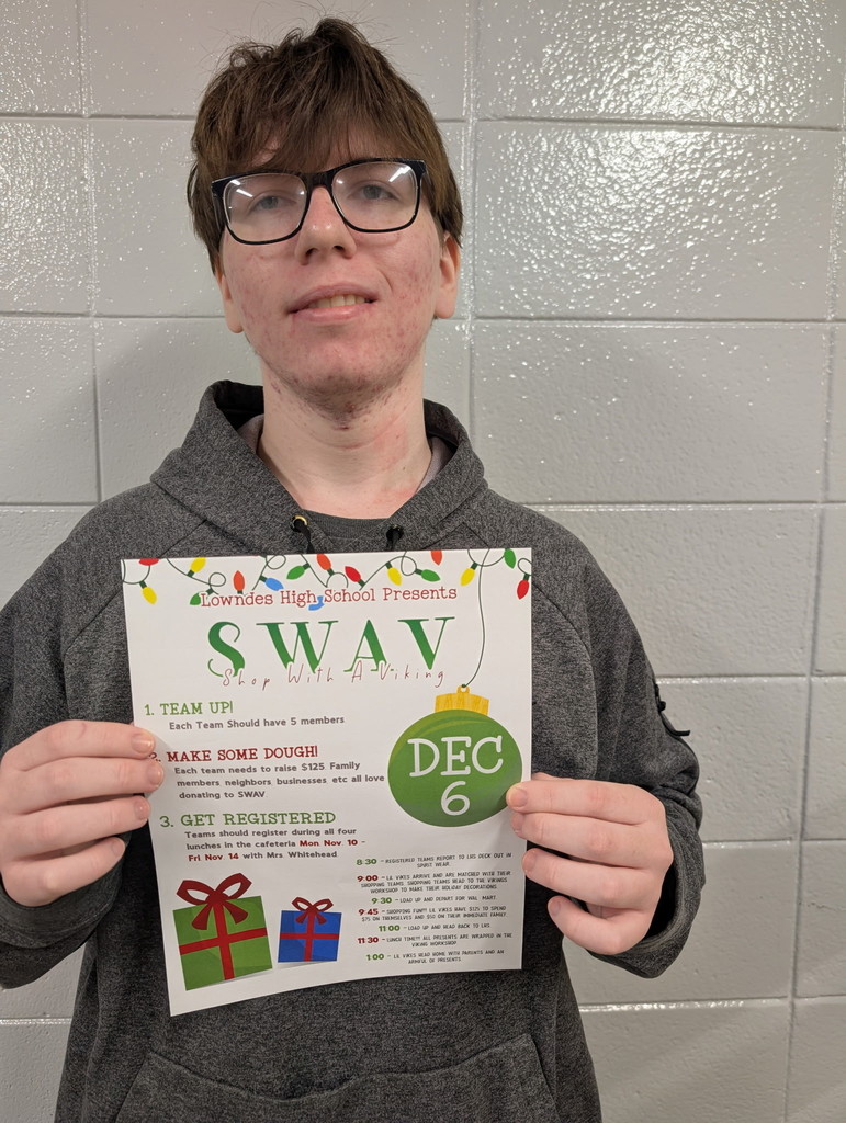 Student with SWAV flier that he designed