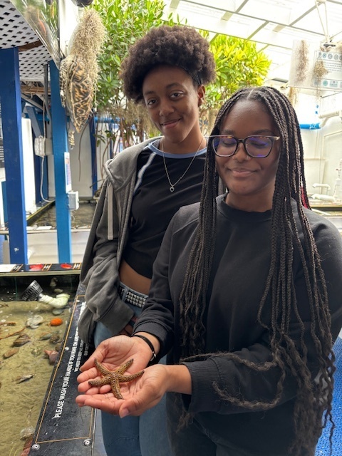 Student holding starfish