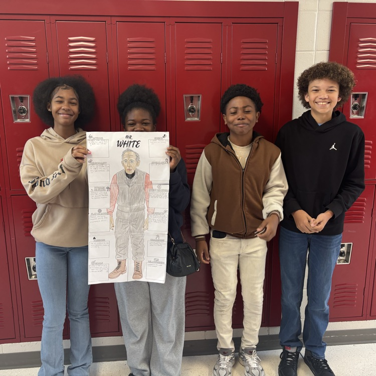 students holding work 