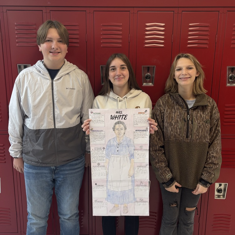 students holding work 