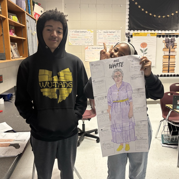 students holding work 