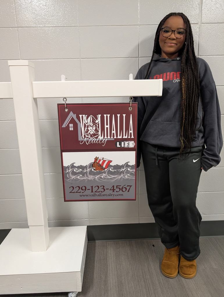 Student with sign that she designed.