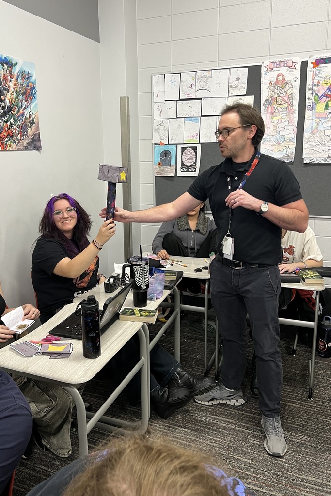 Mr. Taylor with student and hammer