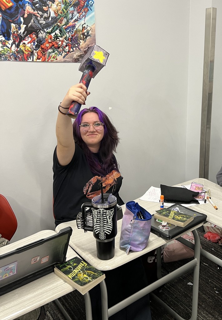 Student wielding hammer