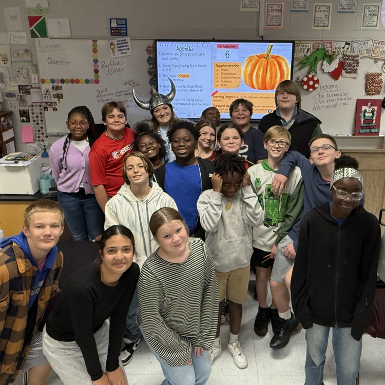 teacher posing with class 