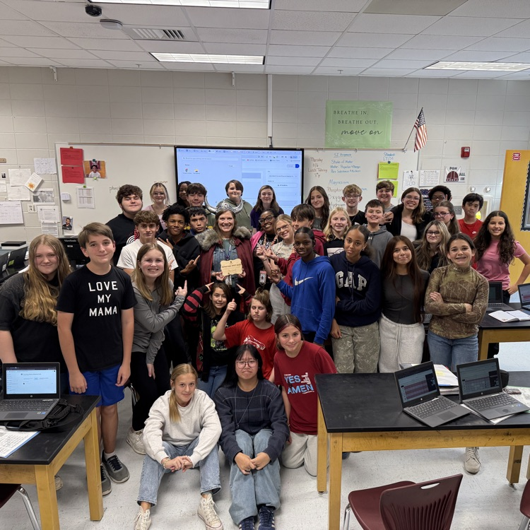 teacher posing with class 