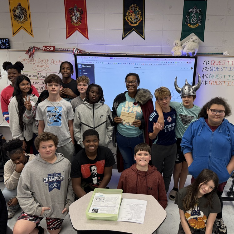 teacher posing with class 