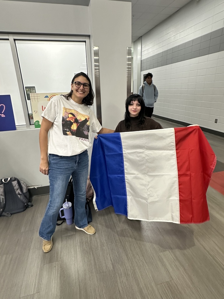 Teacher and student with a French flag