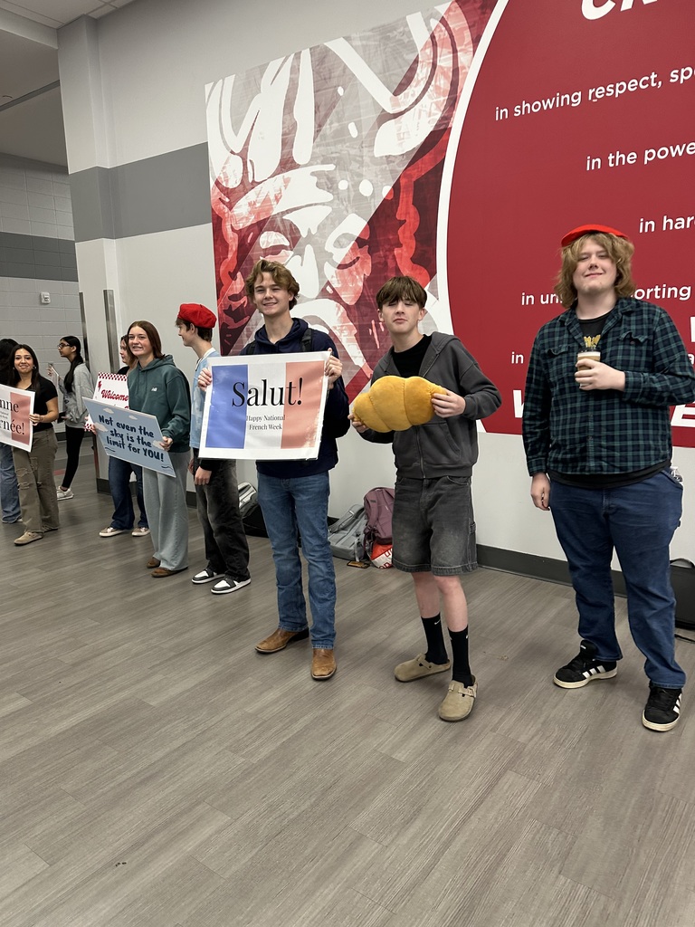 French students on Welcome Wednesday with signs