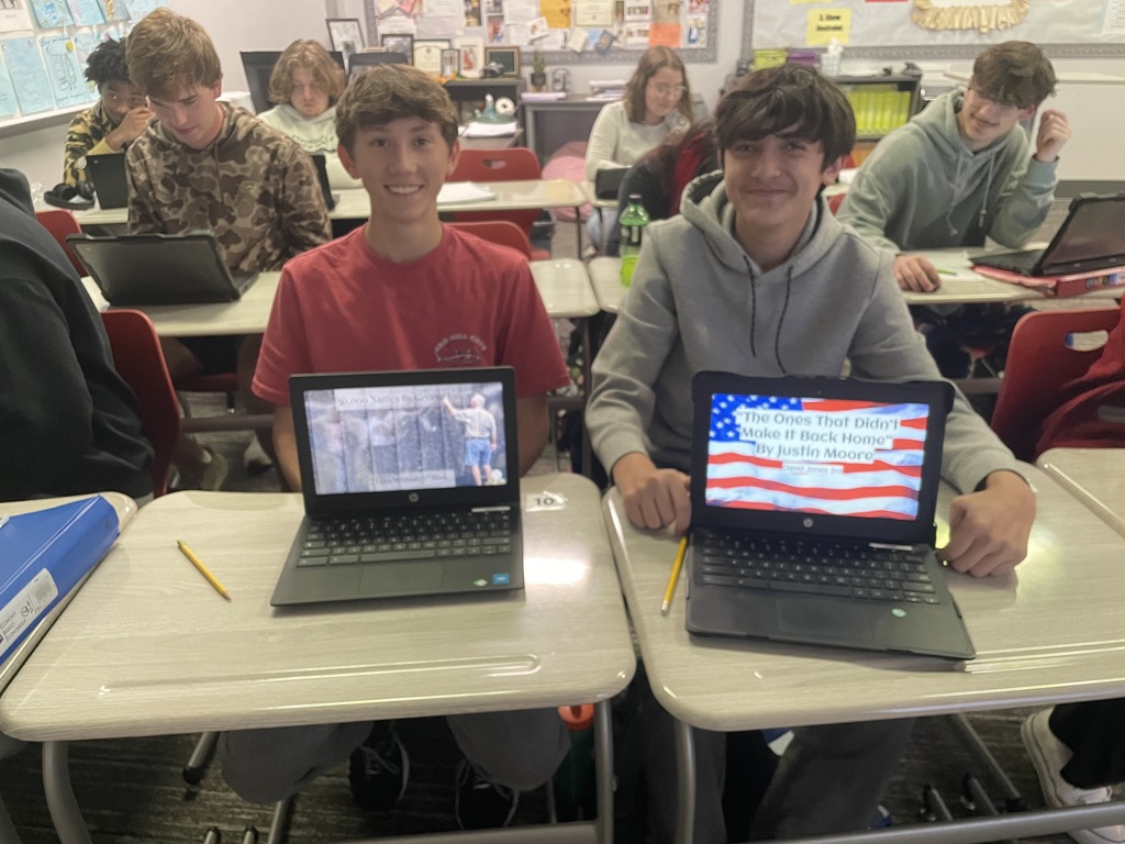 Students displaying their work on their chromebooks