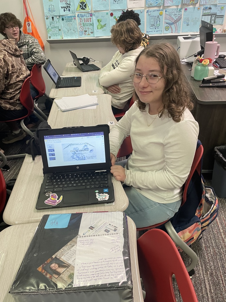 Student displaying her work on her chromebook