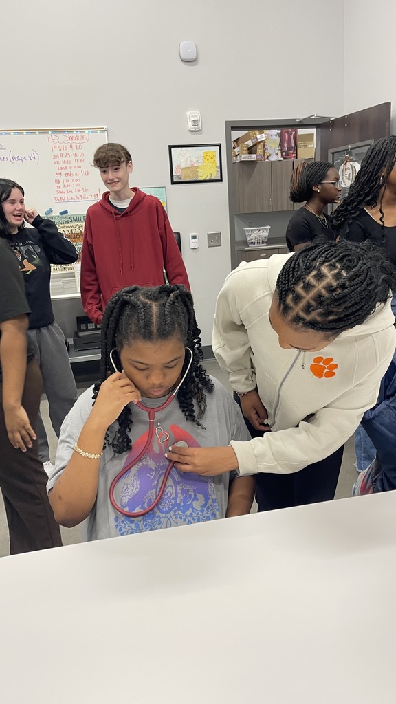 Student learning to use stethoscope