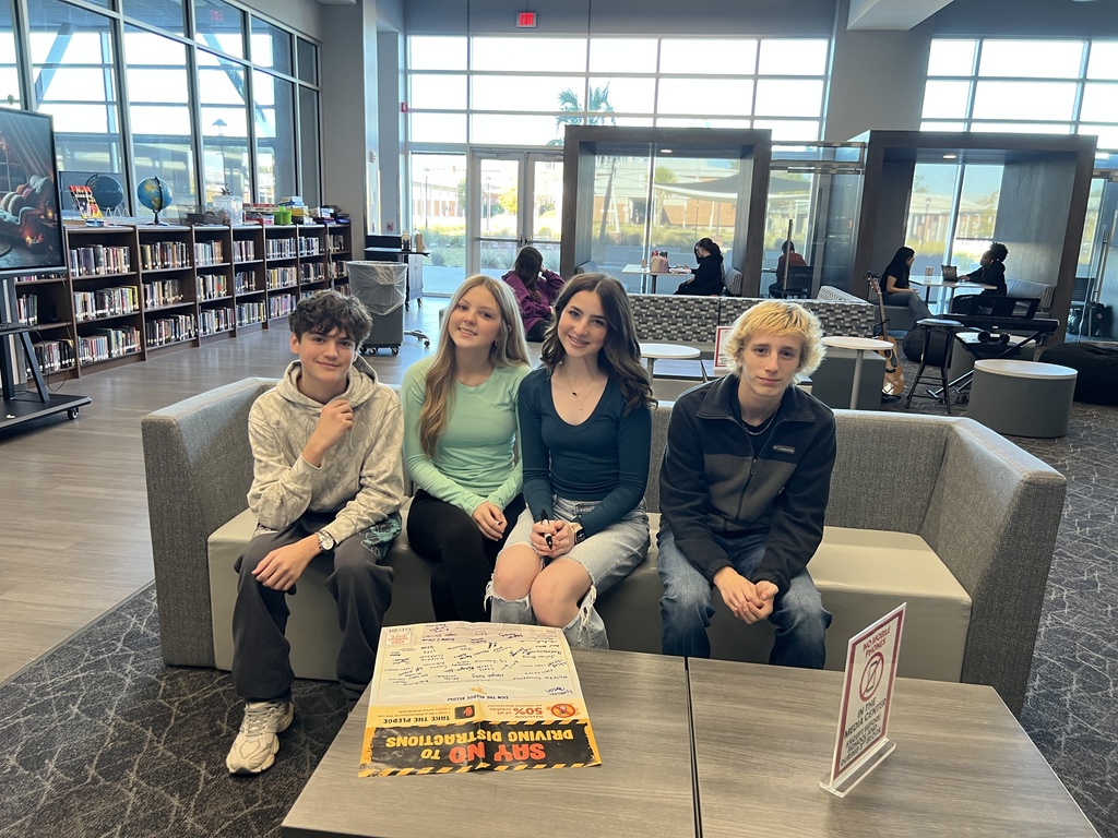 Drivers Education students with the Say No to Driving Distractions pledge poster