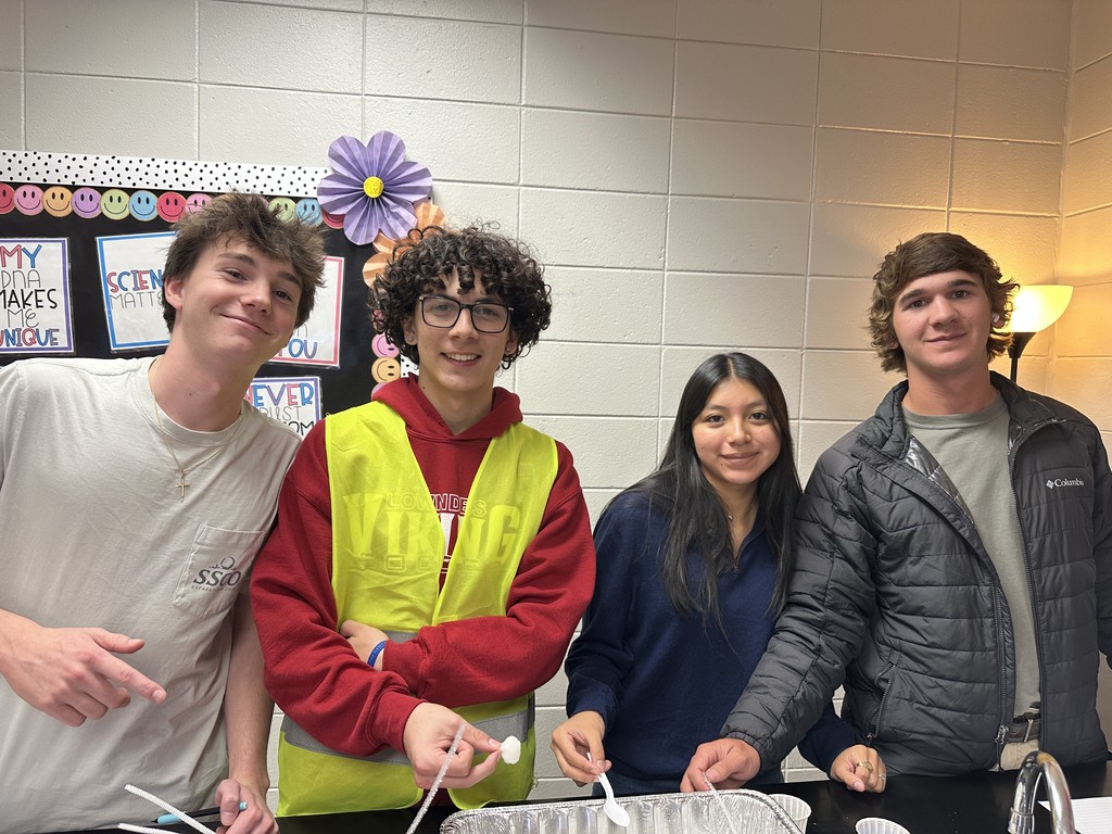 Students working an oil spill experiment