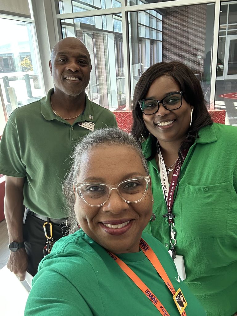 Adults wearing green